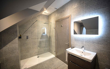 Taransay House guest rooms contain spacious luxury bathrooms with powerful shower bath and electric mirror