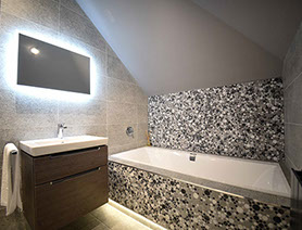 Taransay House in Portree contains modern bath shower rooms with electric mirrors
